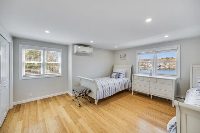 a bedroom with a large bed and a window