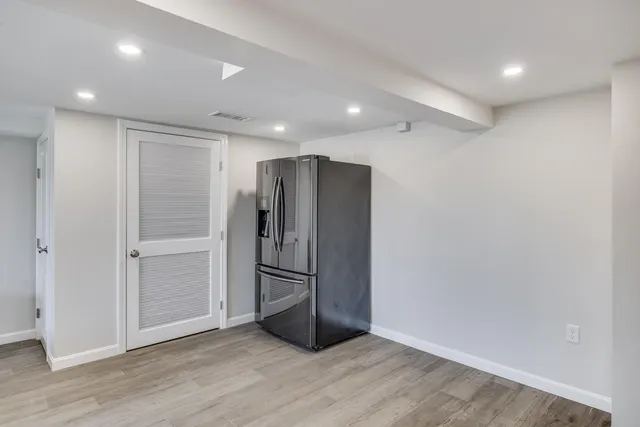 a picture of a bathroom with a sink and a mirror