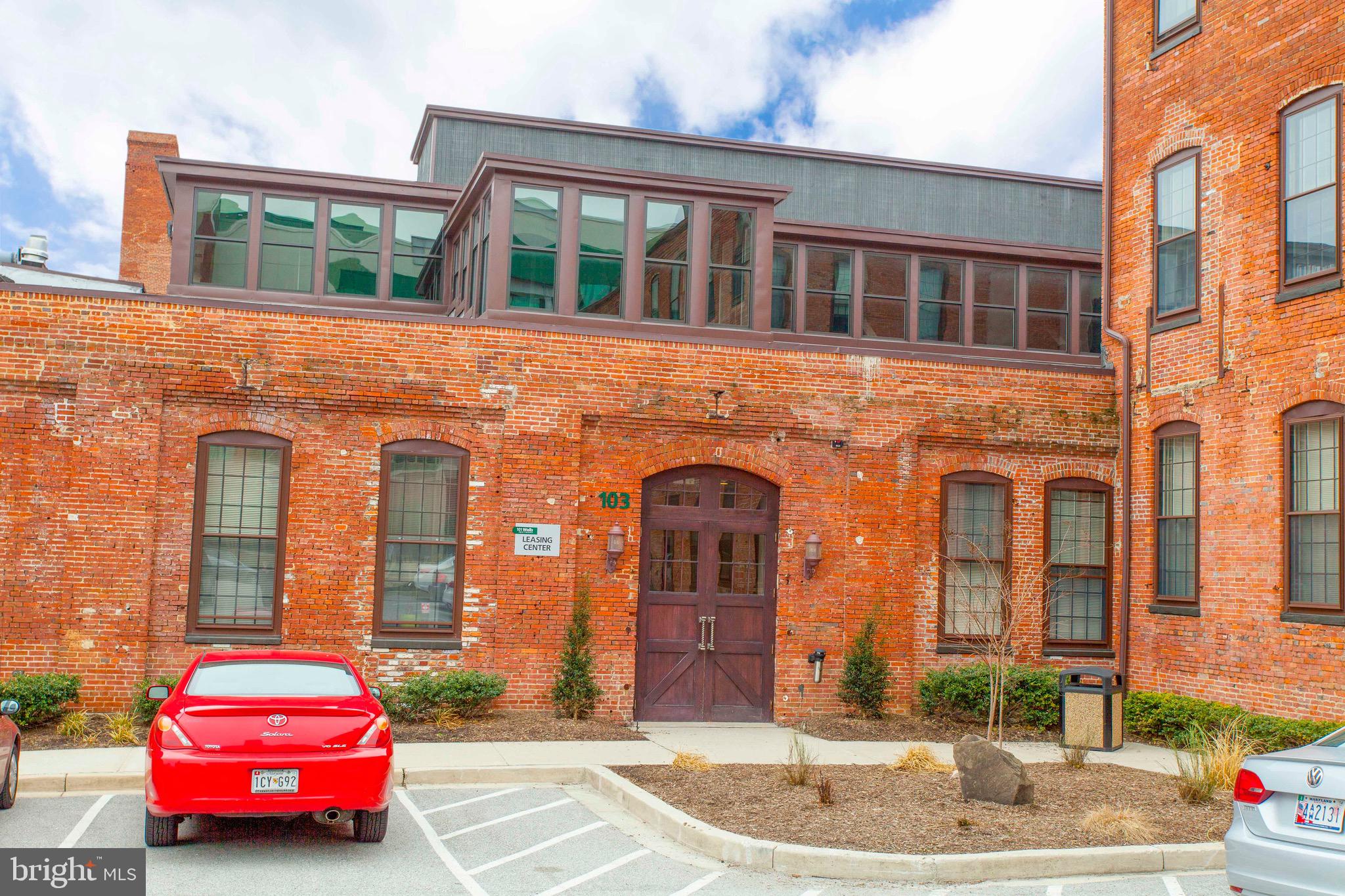 101 Wells Baltimore Md 21230, Unit 2BR Baltimore, MD 21230 - Photo 17 of 46 a front view of a house with a garden