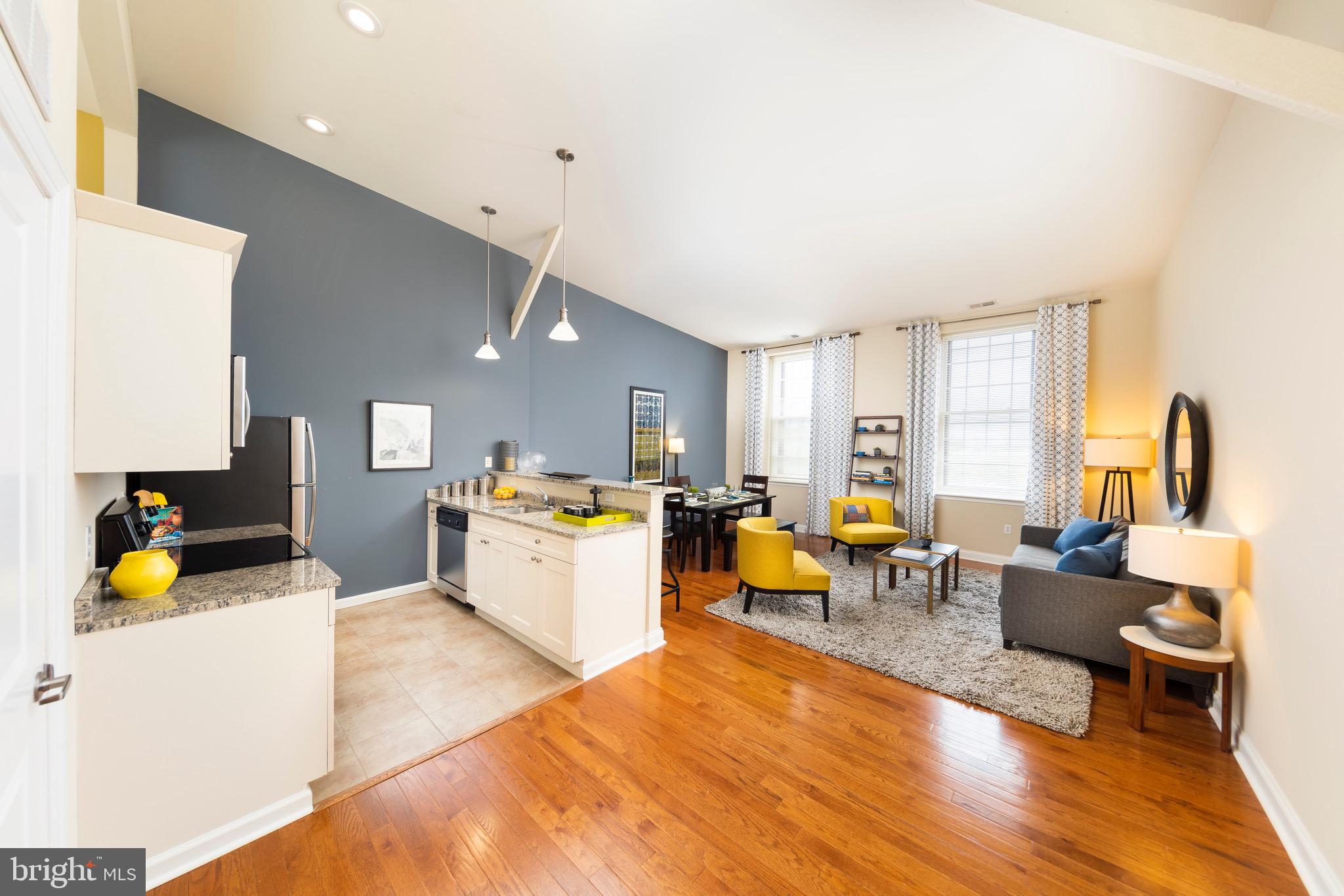 101 Wells Baltimore Md 21230, Unit 2BR Baltimore, MD 21230 - Photo 38 of 46 a living room with furniture and wooden floor