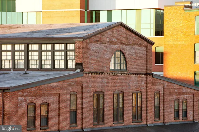 a front view of a house with large windows