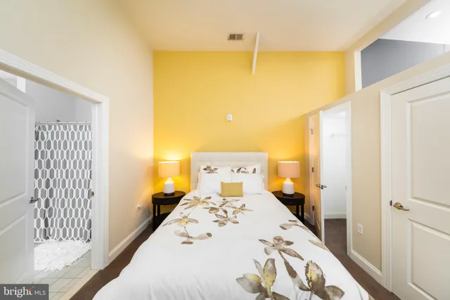 a bedroom with a bed and a dresser