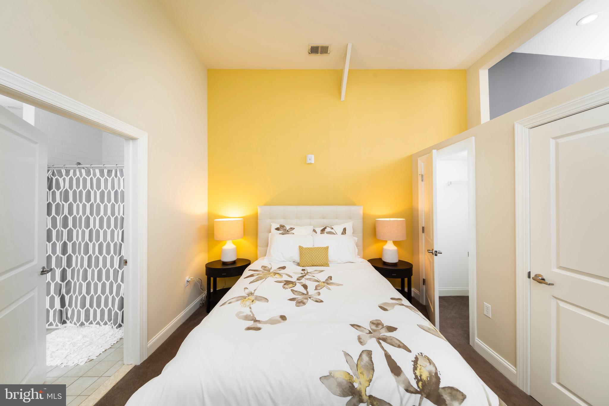 101 Wells Baltimore Md 21230, Unit 2BR Baltimore, MD 21230 - Photo 43 of 46 a bedroom with a bed and wooden floor