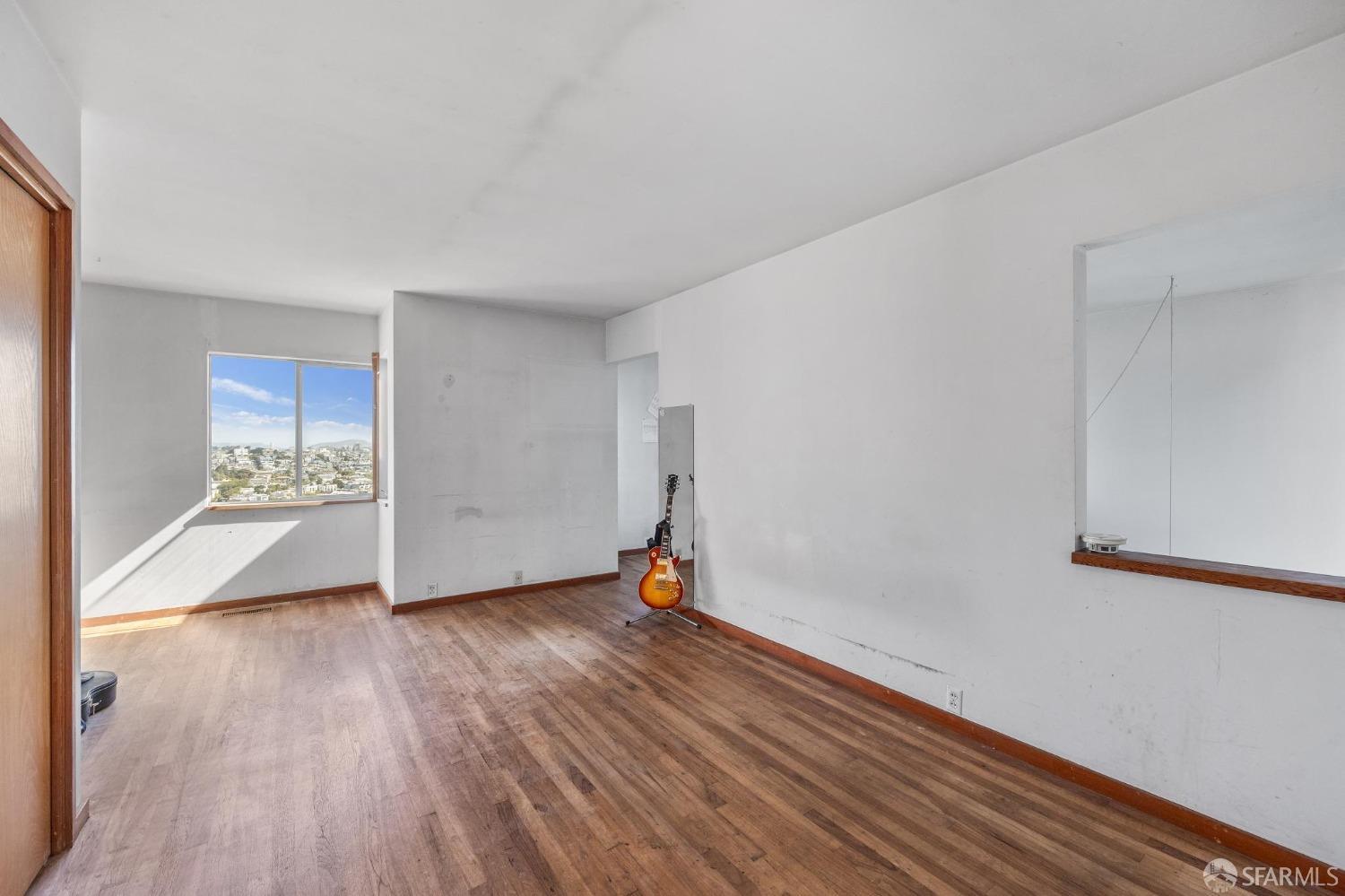 4071 20th Street San Francisco, CA 94114 - Photo 19 of 27 a view of empty room with wooden floor