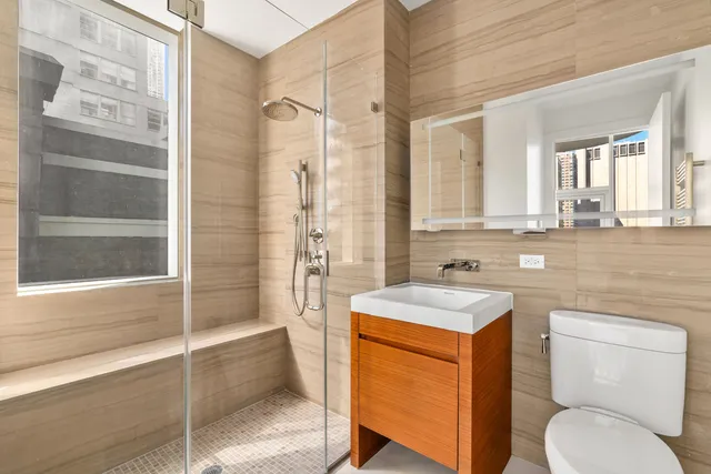 a spacious bathroom with a double vanity sink and a bathtub