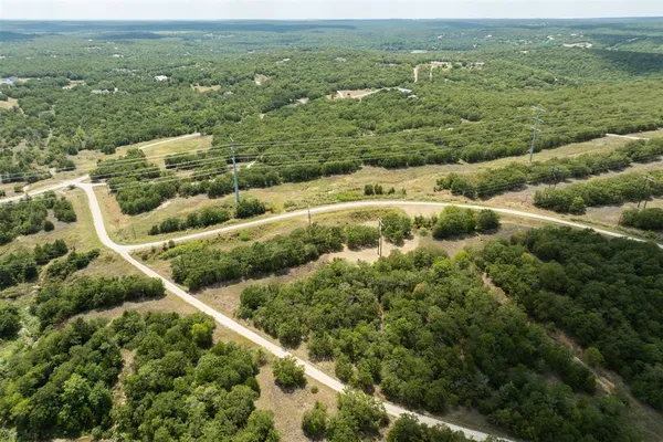 a view of a field with an ocean