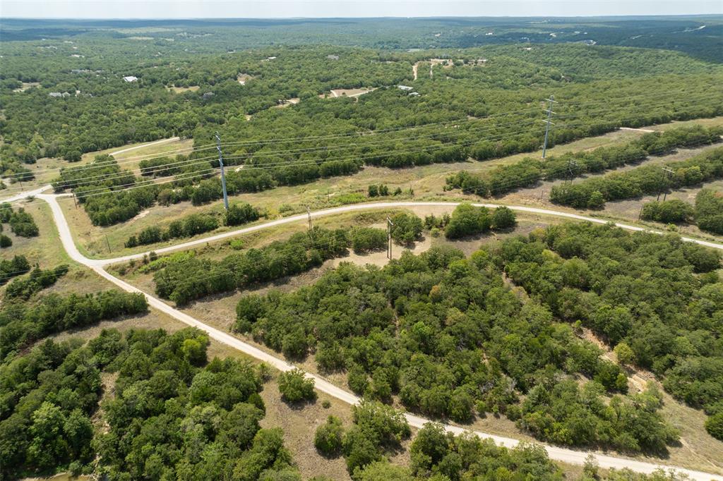 721 Sandstone Court Sunset, TX 76270 - Photo 10 of 19 an aerial view of residential houses with outdoor space and trees