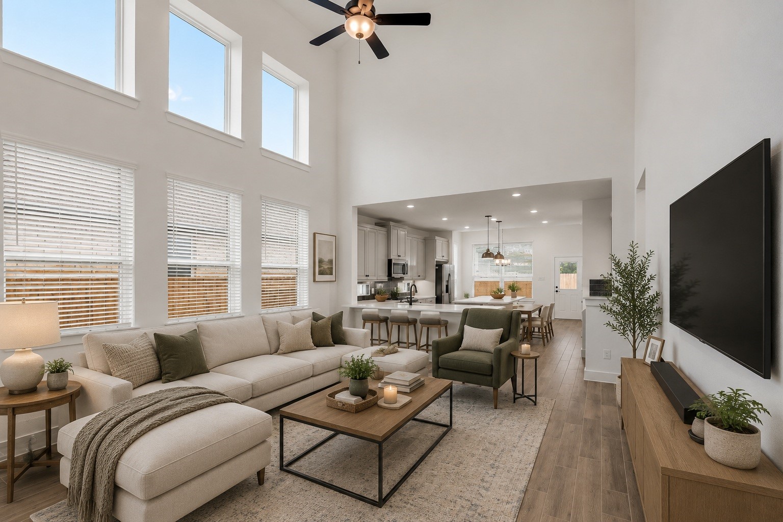 12853 Meadow Wind Way Conroe, TX 77302 - Photo 47 of 47 Oversized Windows greet you upon entry to the Living space open to the Kitchen and Dining.
Spacious and Open floor plan, Family Room, Kitchen and Dining. Virtually staged Photo