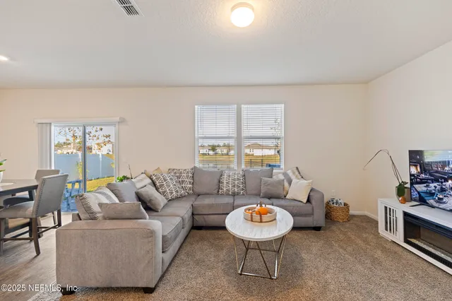 a living room with furniture and a table
