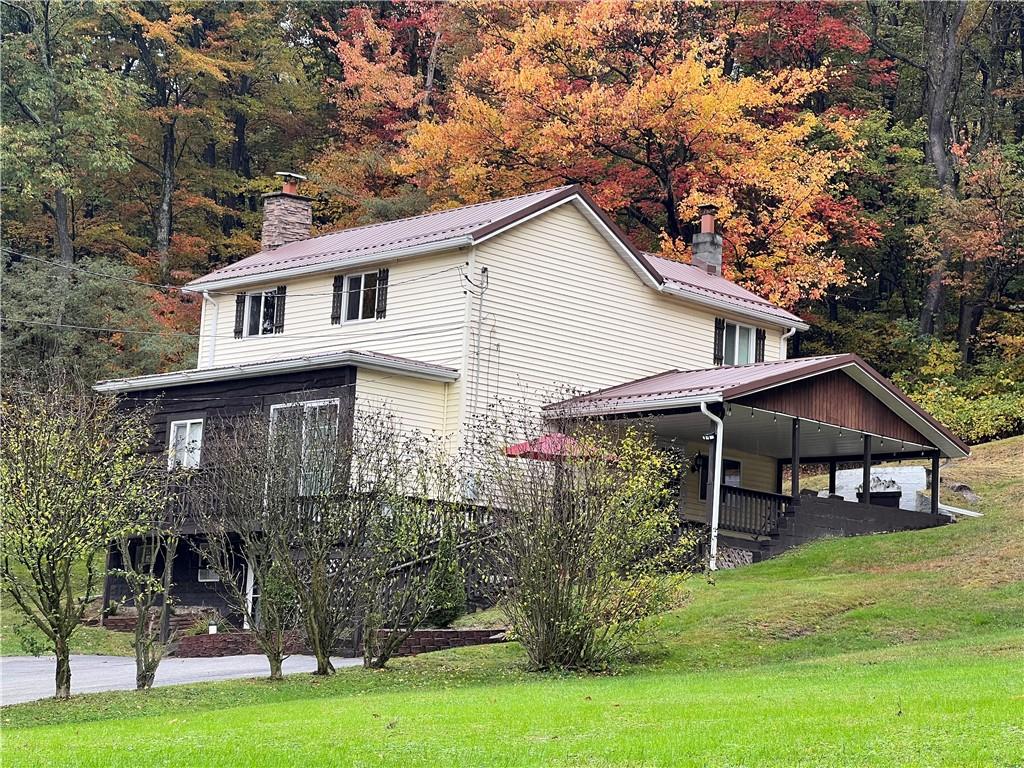159 Martin Farm Road Dunbar, PA 15431 - Photo 3 of 22 a view of a house with a yard porch and sitting area