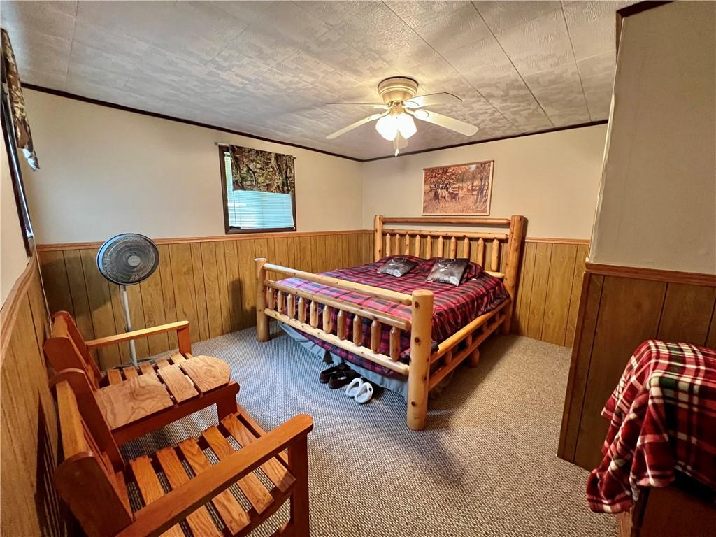 159 Martin Farm Road Dunbar, PA 15431 - Photo 10 of 22 a bedroom with a bed and a chandelier