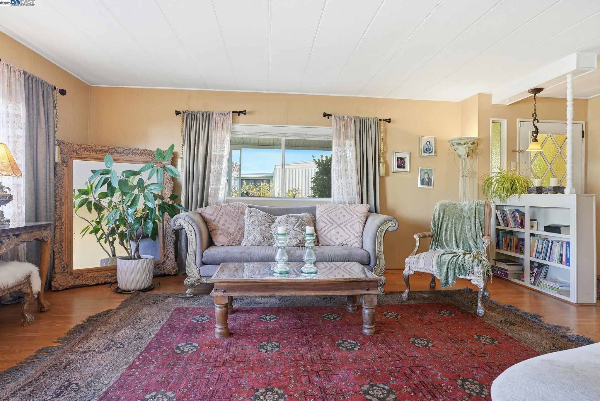 4141 Deep Creek Road, Unit 89 Fremont, CA 94555 - Photo 12 of 54 a living room with furniture and a large window