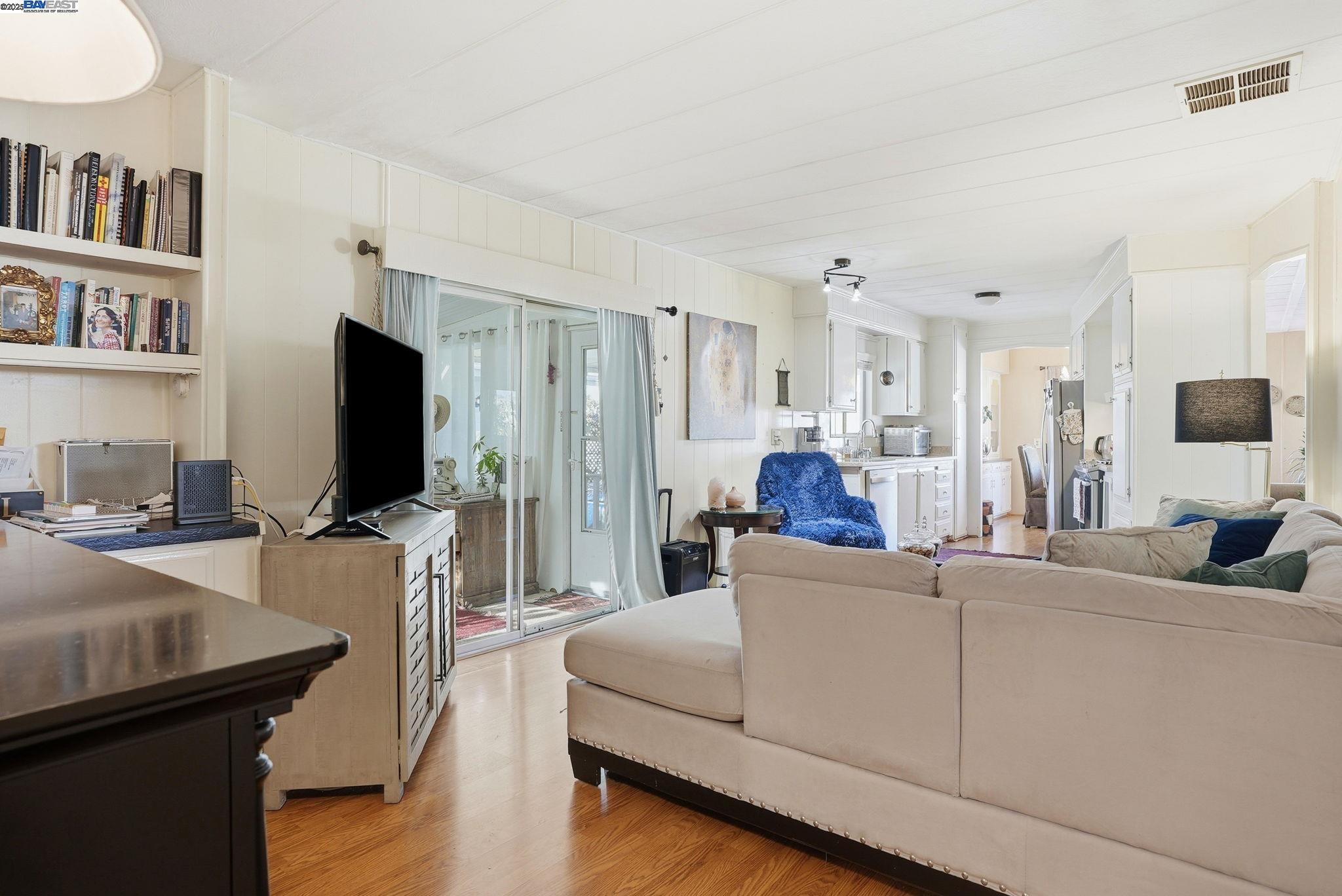 4141 Deep Creek Road, Unit 89 Fremont, CA 94555 - Photo 15 of 54 a living room with furniture and a flat screen tv