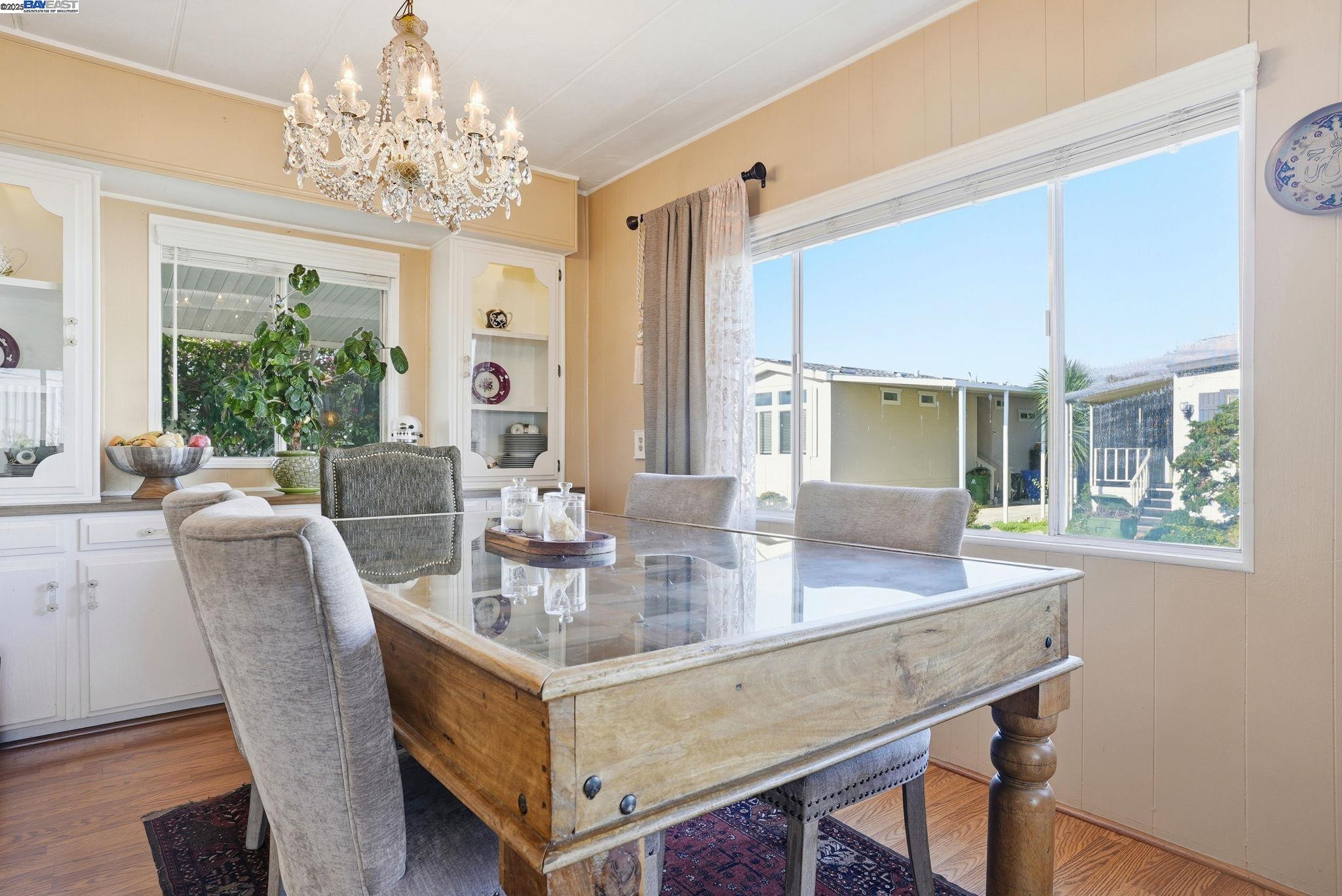 4141 Deep Creek Road, Unit 89 Fremont, CA 94555 - Photo 19 of 54 a dining room with furniture a livingroom and chandelier