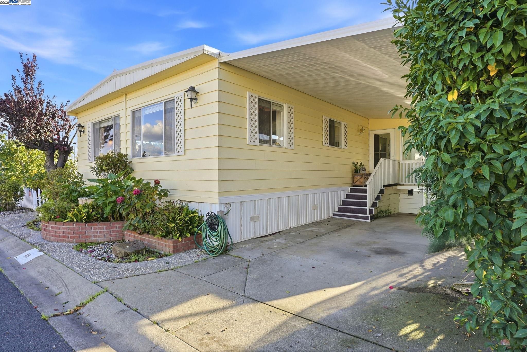 4141 Deep Creek Road, Unit 89 Fremont, CA 94555 - Photo 2 of 54 a view of a house with a yard