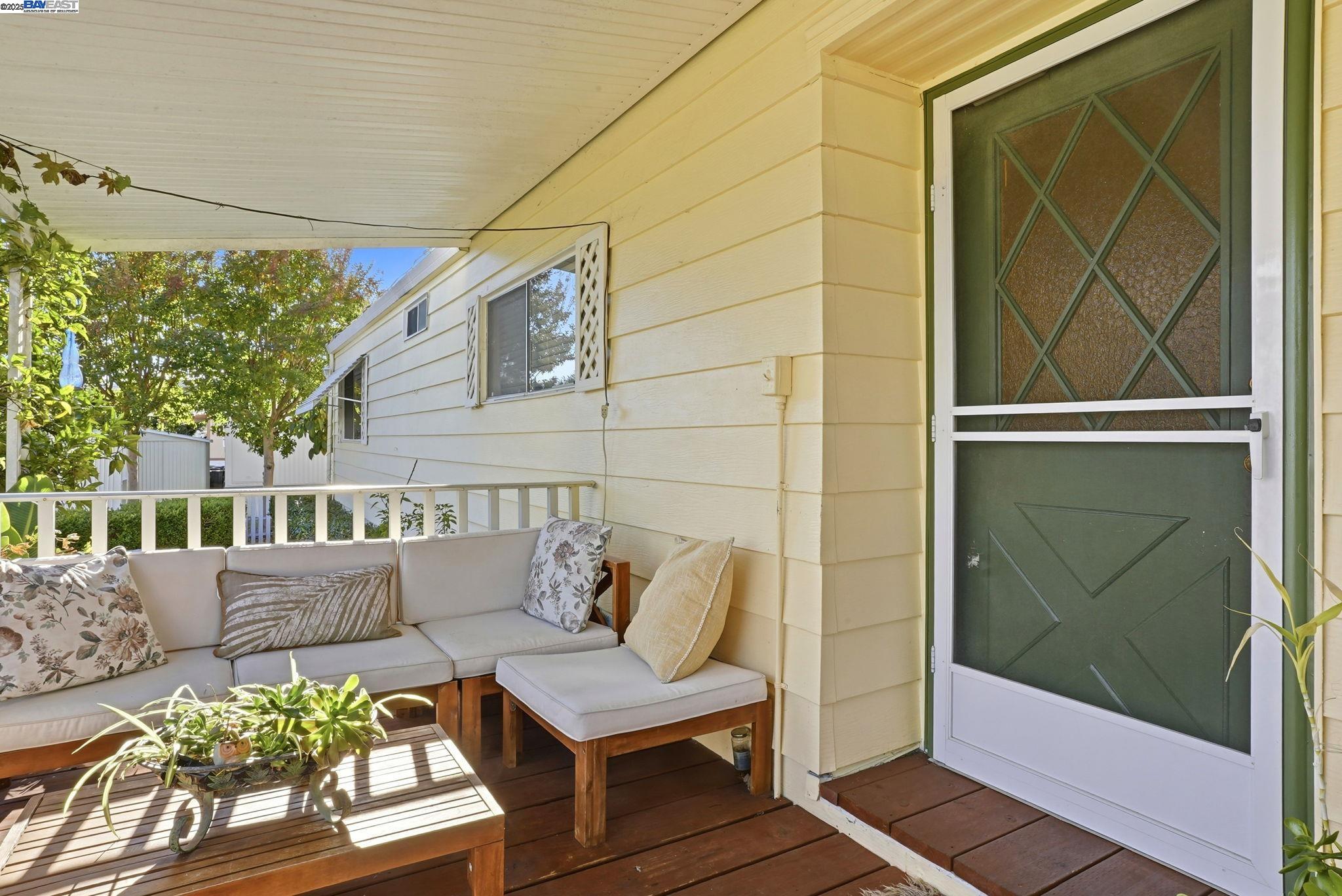 4141 Deep Creek Road, Unit 89 Fremont, CA 94555 - Photo 6 of 54 a view of a balcony with furniture and wooden floor