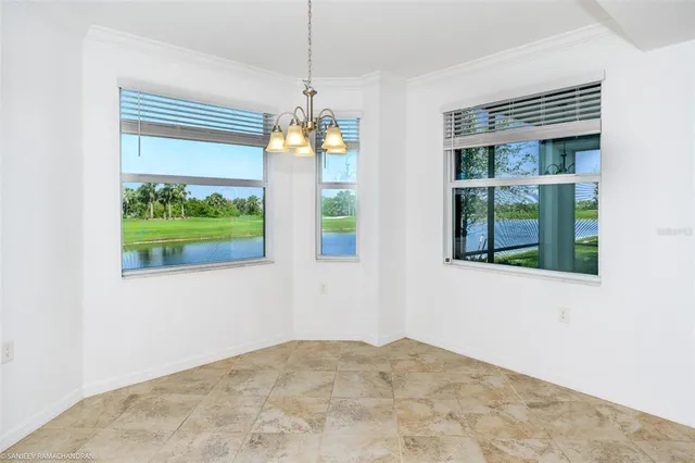 a view of a lake with a house in background