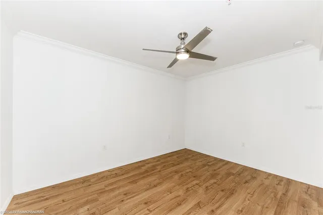 a bathroom with a granite countertop bathtub shower sink vanity and toilet