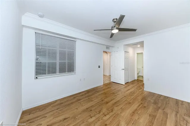 a house with a yard and a car park in front of it