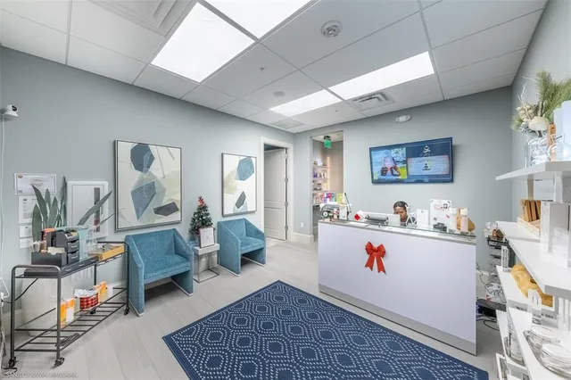 front view of a brick building with a yard