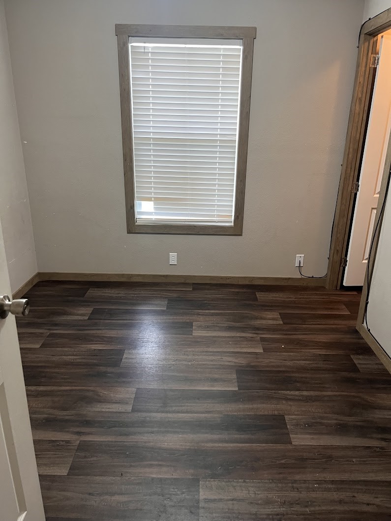 4 Laurel Court Cleveland, TX 77327 - Photo 4 of 24 a view of room with window and hardwood floor