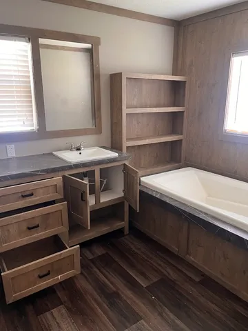 a bathroom with a sink and a mirror