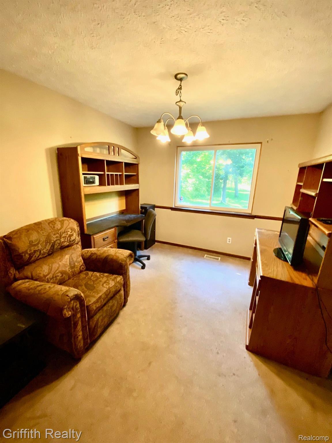 5761 Warner Road Fowlerville, MI 48836 - Photo 24 of 63 dining room w/rear views of nature and wildlife