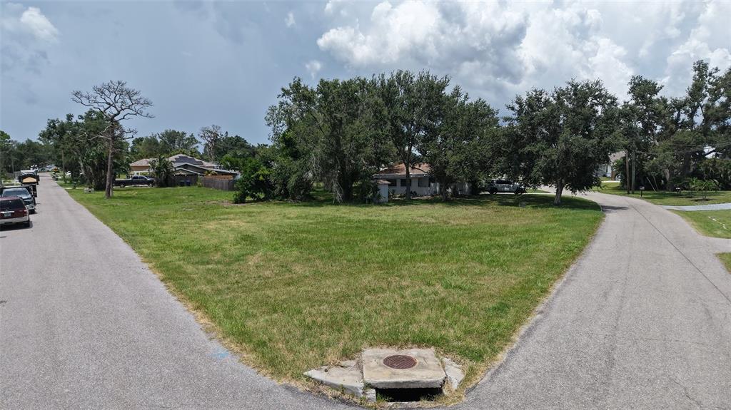 513 Pine Road Nokomis, FL 34275 - Photo 12 of 22 a view of a street with a car parked in the background