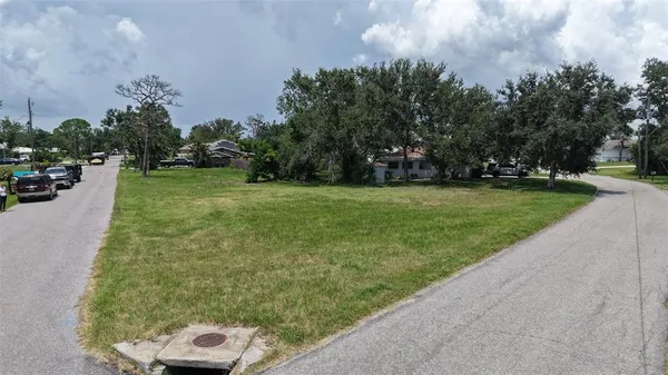 a view of a field with of trees