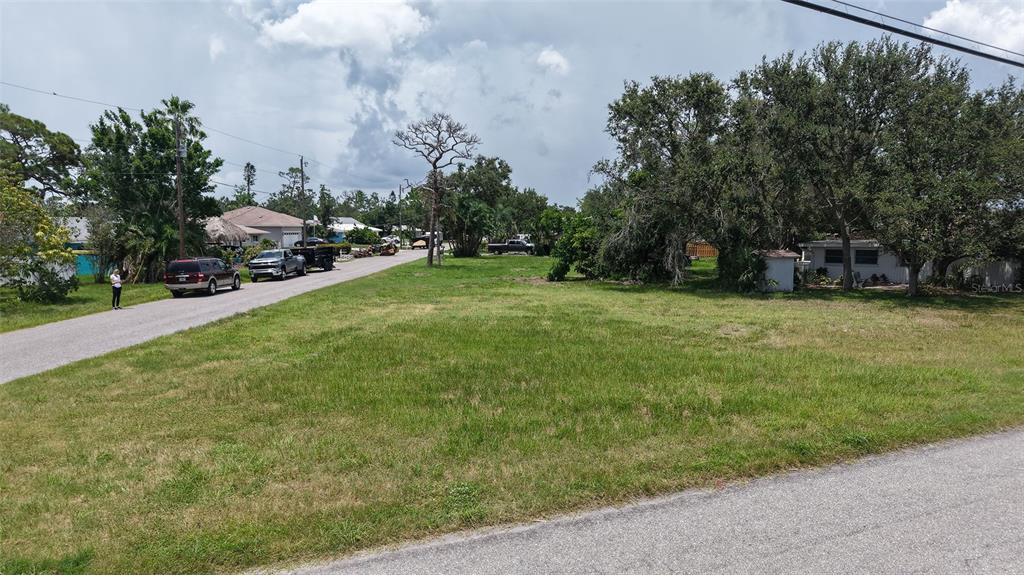 513 Pine Road Nokomis, FL 34275 - Photo 14 of 22 a view of a street with houses