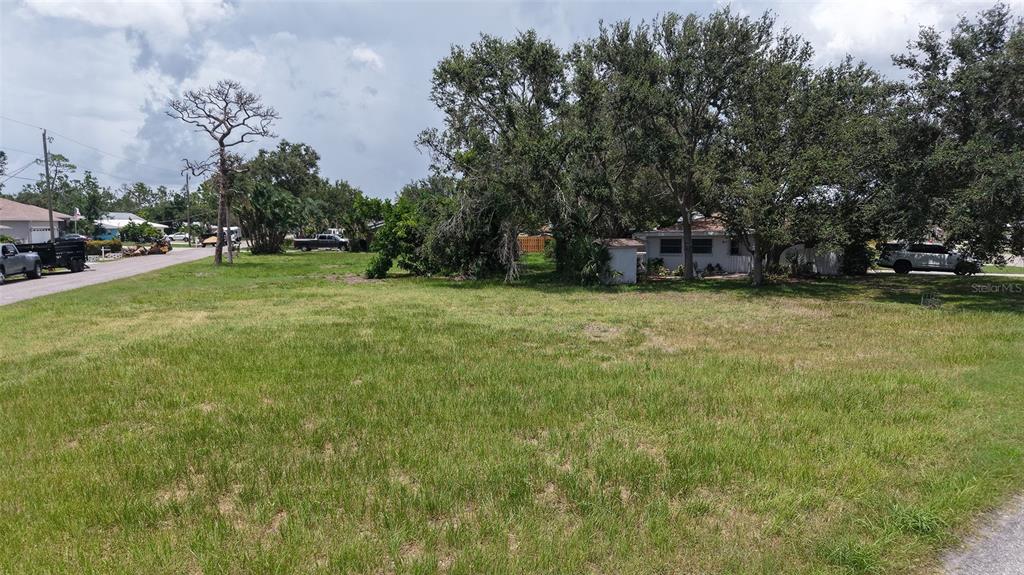 513 Pine Road Nokomis, FL 34275 - Photo 2 of 22 a view of a street with houses