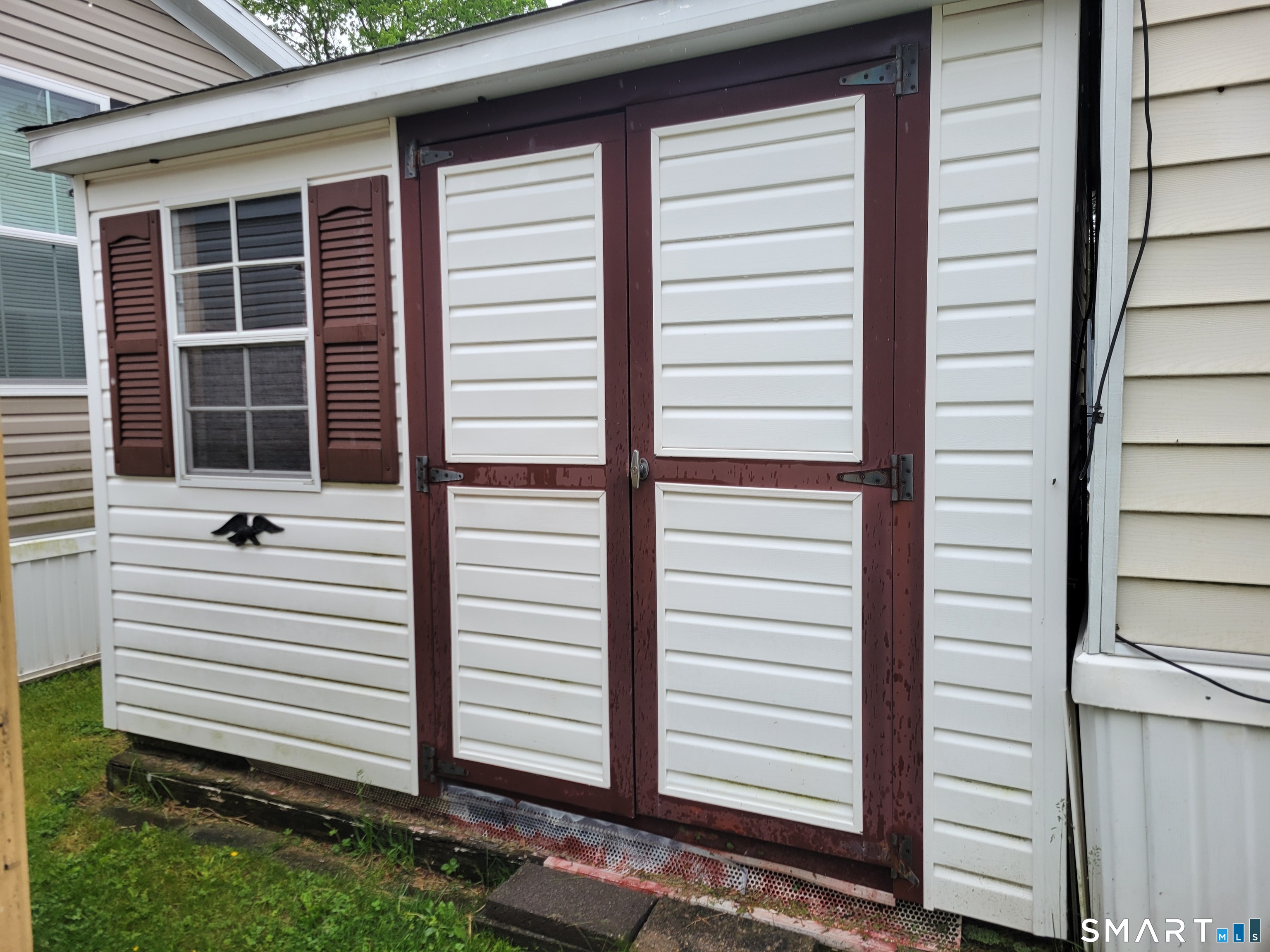 1290 N Road Groton, CT 06340 - Photo 11 of 11 a view of a house with a window and stairs