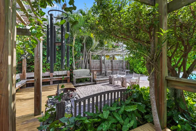 a view of a chair and tables in the balcony