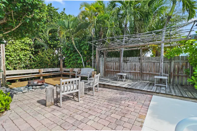 a view of a swimming pool with an outdoor seating
