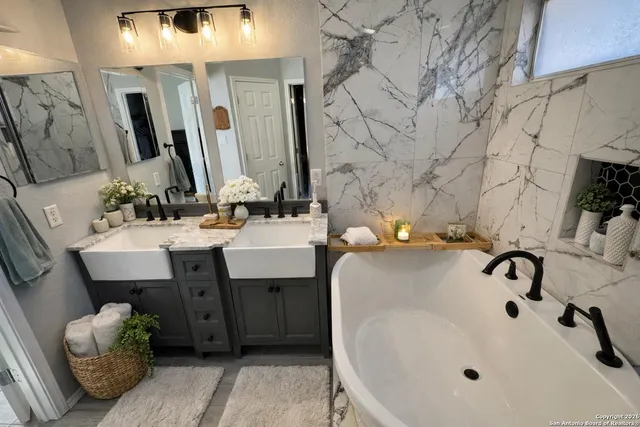 a bedroom with a bed and ceiling fan