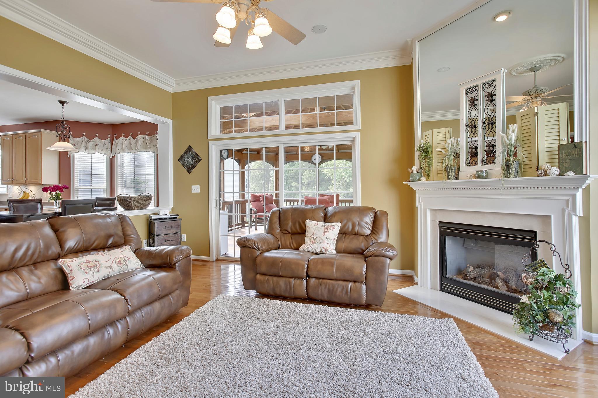 18255 Maple Spring Court Leesburg, VA 20176 - Photo 5 of 30 FR Off Kitchen w/ HW Floors & Fireplace
