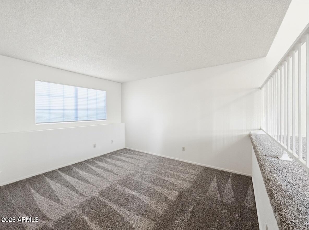 921 West University Drive, Unit 1010 Mesa, AZ 85201 - Photo 12 of 24 an empty room with windows