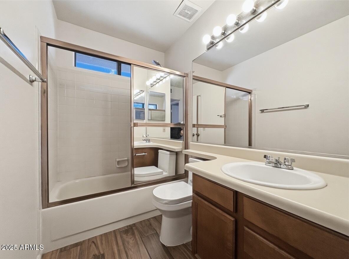 921 West University Drive, Unit 1010 Mesa, AZ 85201 - Photo 15 of 24 a bathroom with a sink a toilet and shower