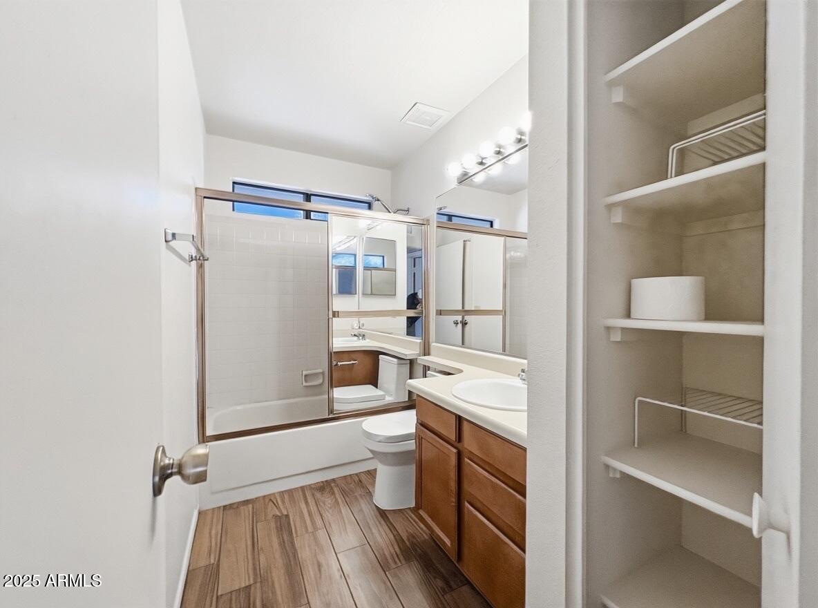 921 West University Drive, Unit 1010 Mesa, AZ 85201 - Photo 16 of 24 a bathroom with a sink a toilet and shower
