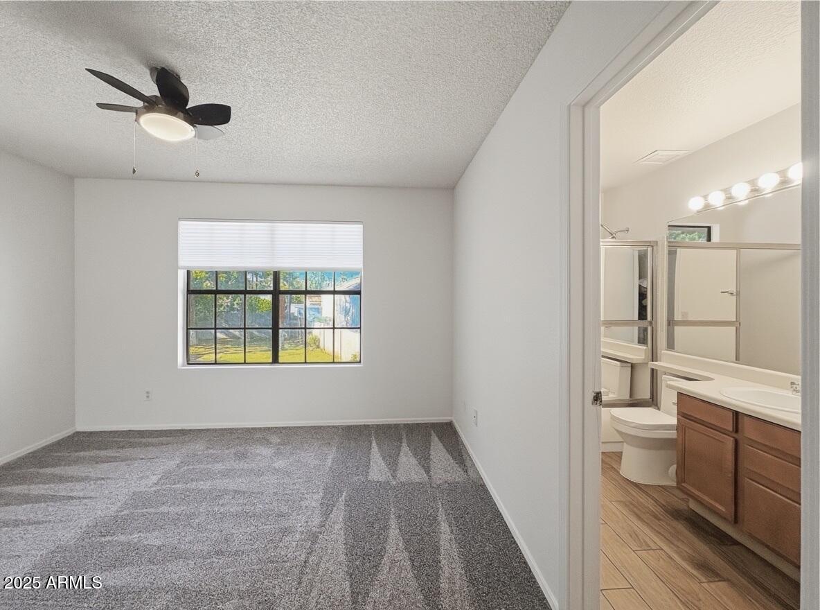 921 West University Drive, Unit 1010 Mesa, AZ 85201 - Photo 17 of 24 a view of bathroom with a toilet a sink and a bathtub