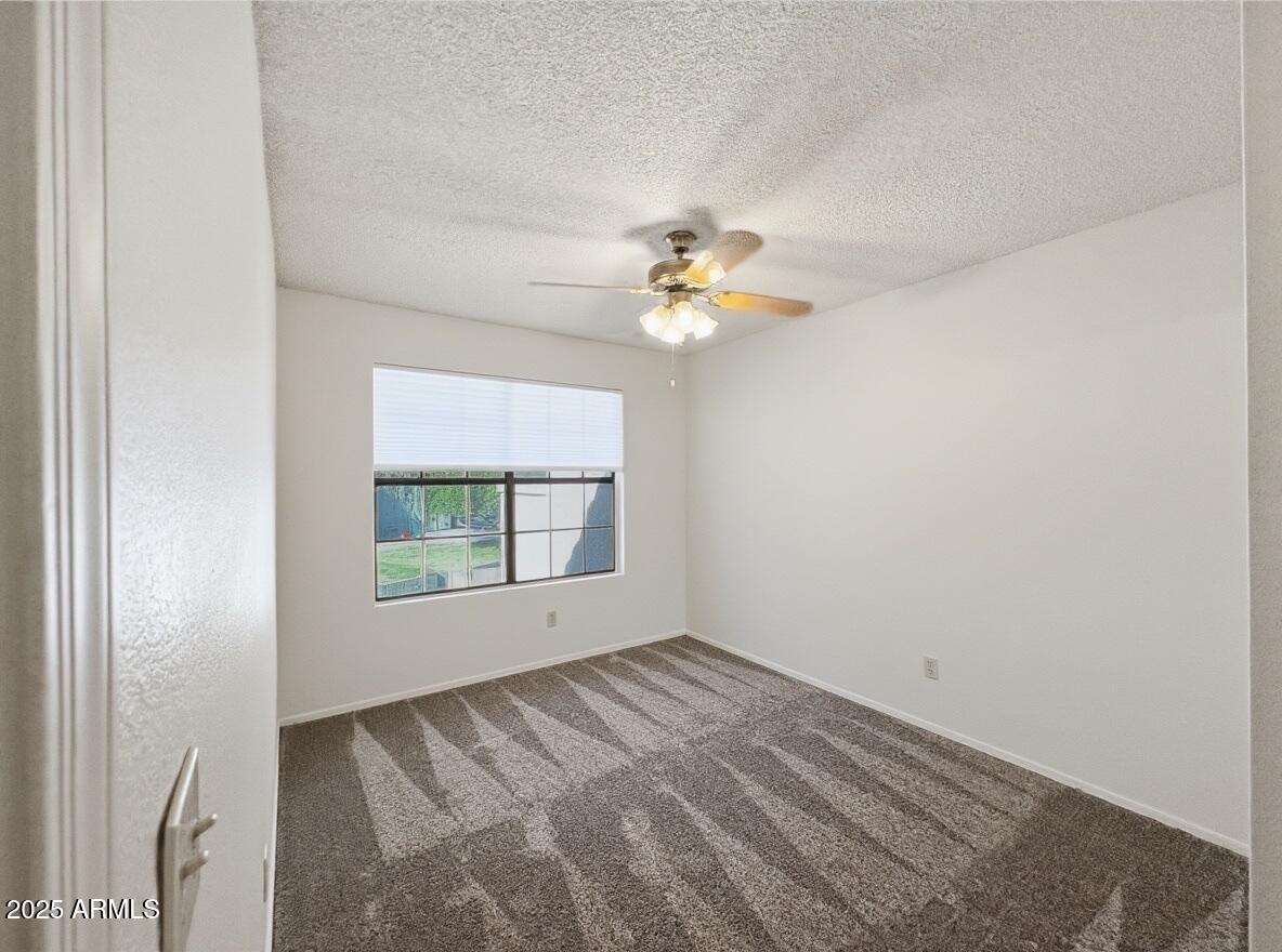 921 West University Drive, Unit 1010 Mesa, AZ 85201 - Photo 20 of 24 an empty room with a window