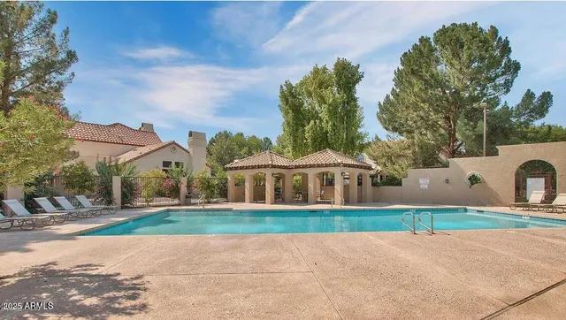 a view of house with yard and green space