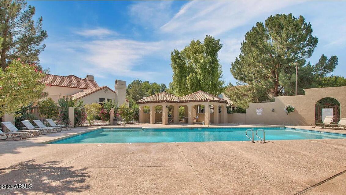 921 West University Drive, Unit 1010 Mesa, AZ 85201 - Photo 2 of 24 a view of house with yard and green space