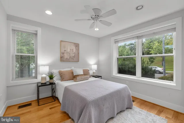 a bedroom with a large bed and a window