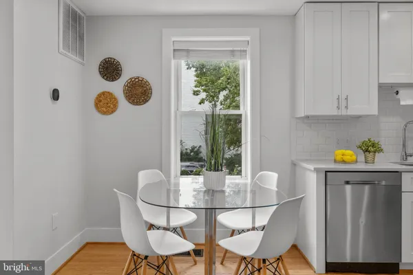 a dining room with furniture and window