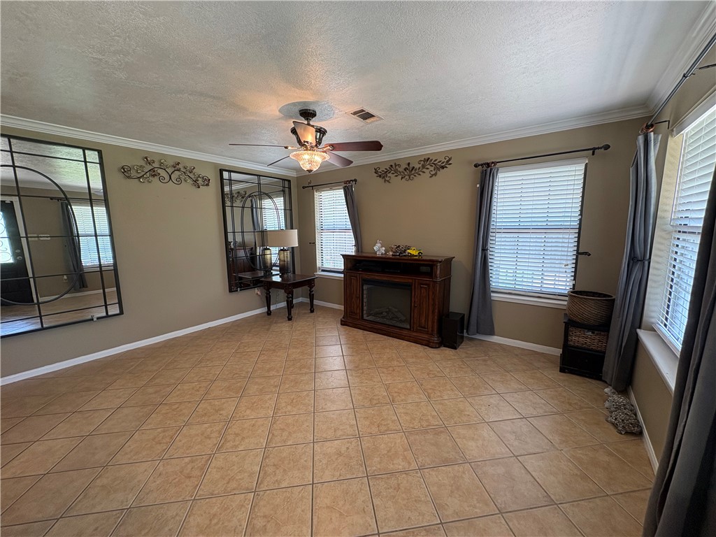 1501 Maple Drive Bryan, TX 77803 - Photo 3 of 19 a view of livingroom with furniture and windows
