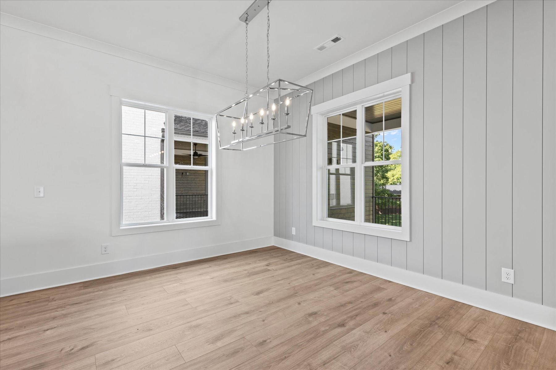 321 Old Shackle Island Road Hendersonville, TN 37075 - Photo 11 of 49 a view of an empty room with wooden floor and a window