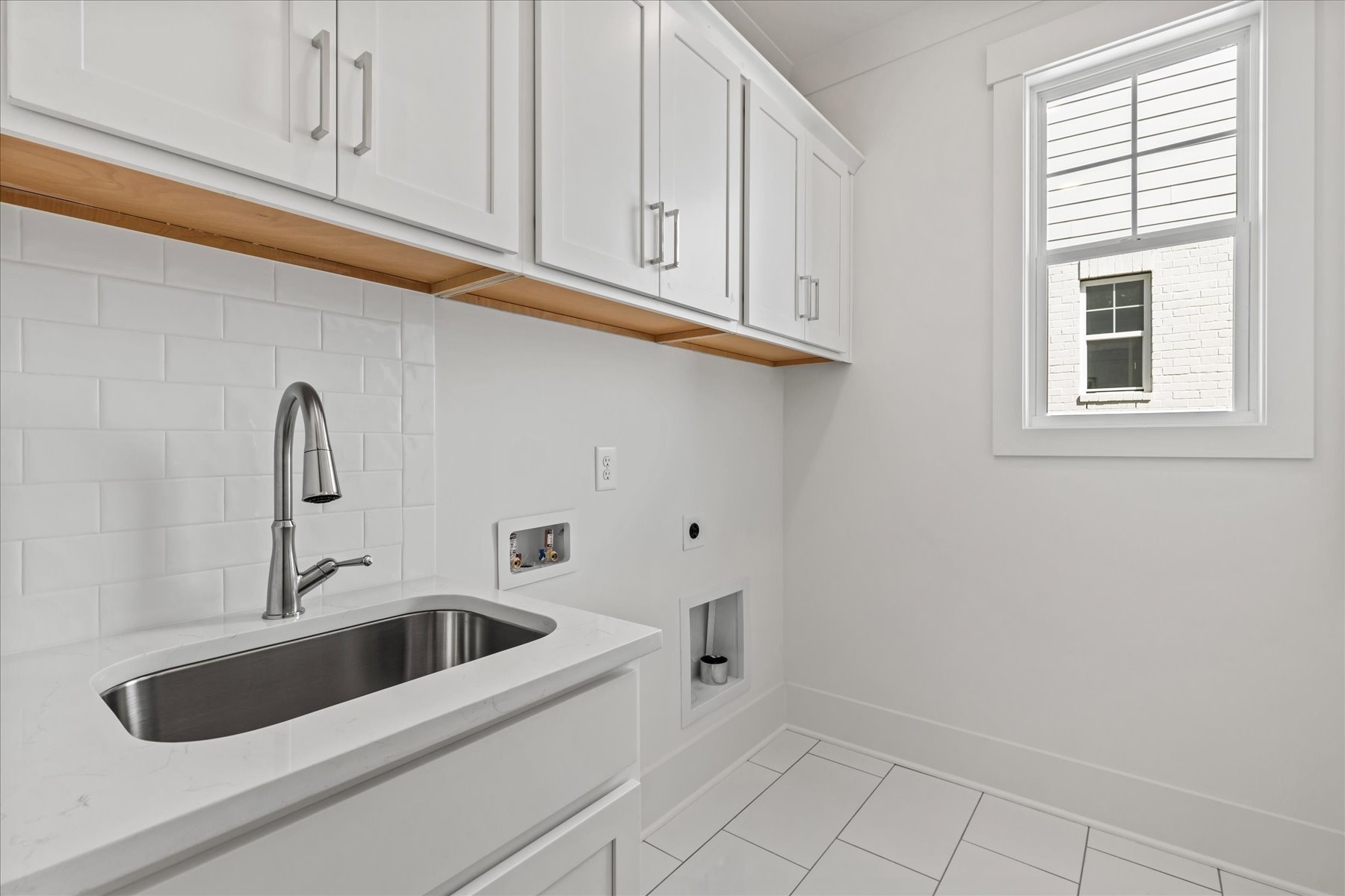 321 Old Shackle Island Road Hendersonville, TN 37075 - Photo 26 of 49 a kitchen with white cabinets and a sink