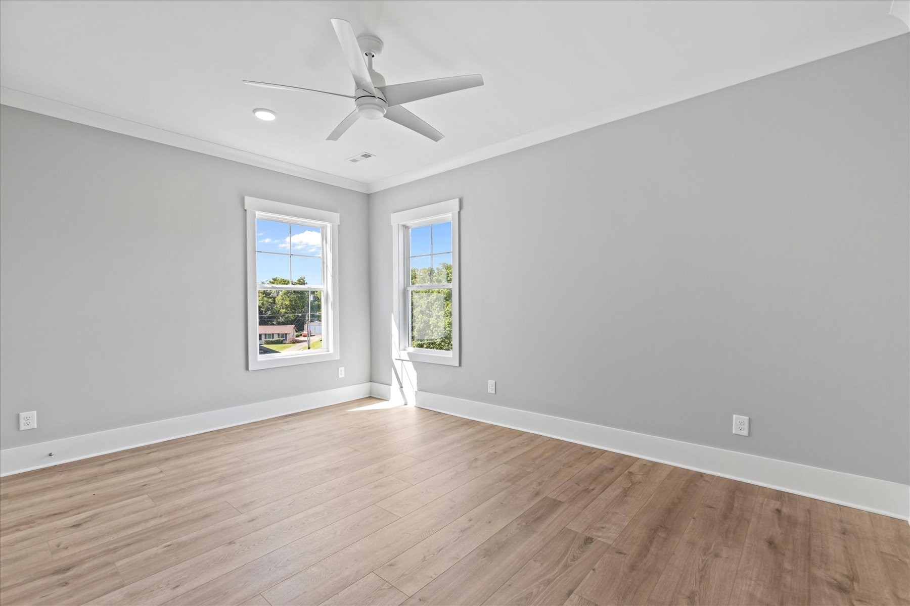 321 Old Shackle Island Road Hendersonville, TN 37075 - Photo 32 of 49 an empty room with wooden floor fan and windows