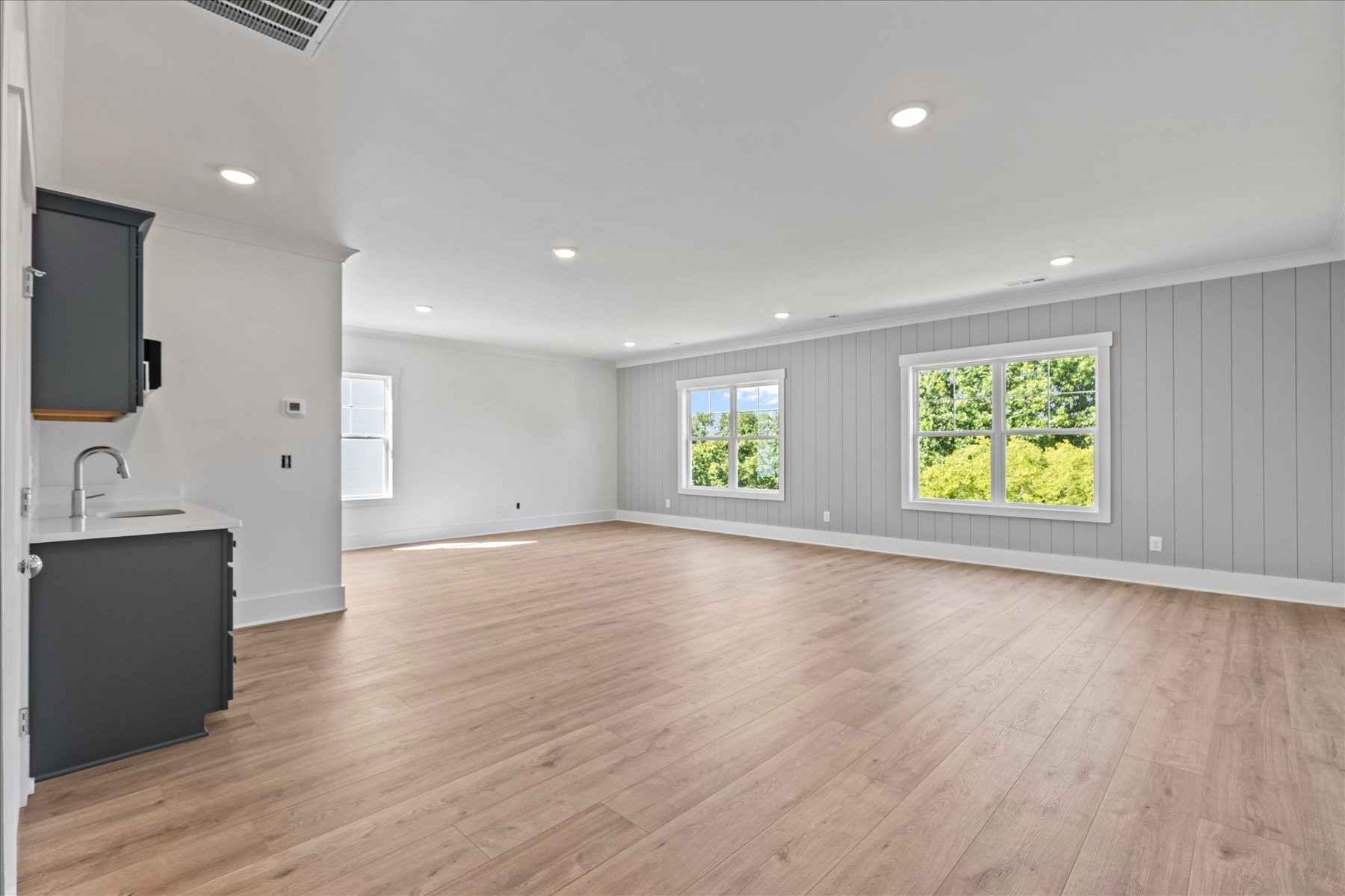 321 Old Shackle Island Road Hendersonville, TN 37075 - Photo 36 of 49 an empty room with wooden floor and windows